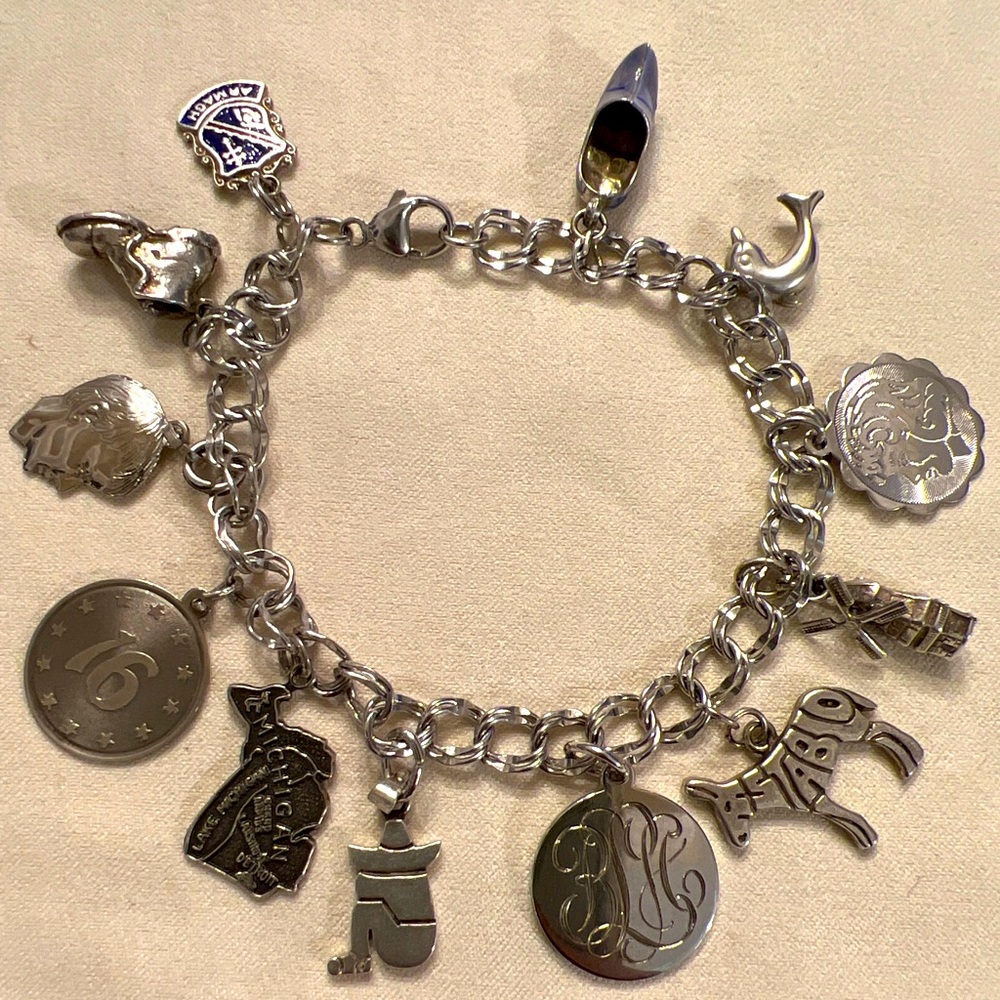 Vintage sterling silver bracelet loaded with silver charms